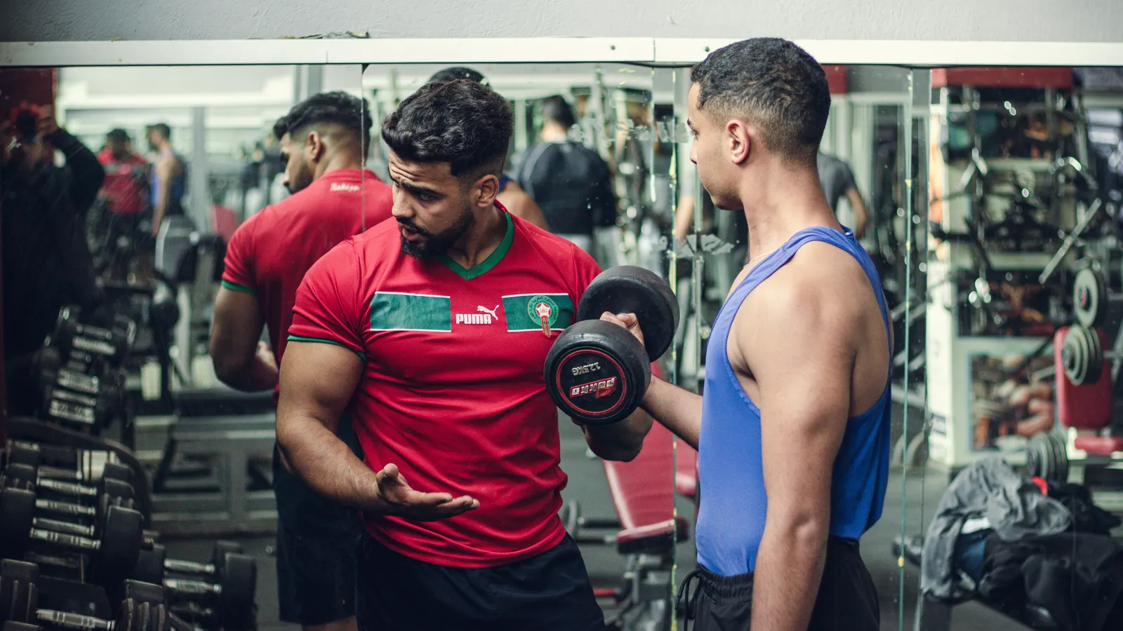 Fitness instructor helping a client with training